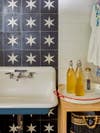 star tile behind laundry sink