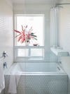 white tiled bathroom tub shower