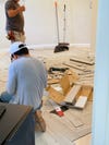 men setting up flooring 