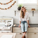 woman in white vintage kitchen