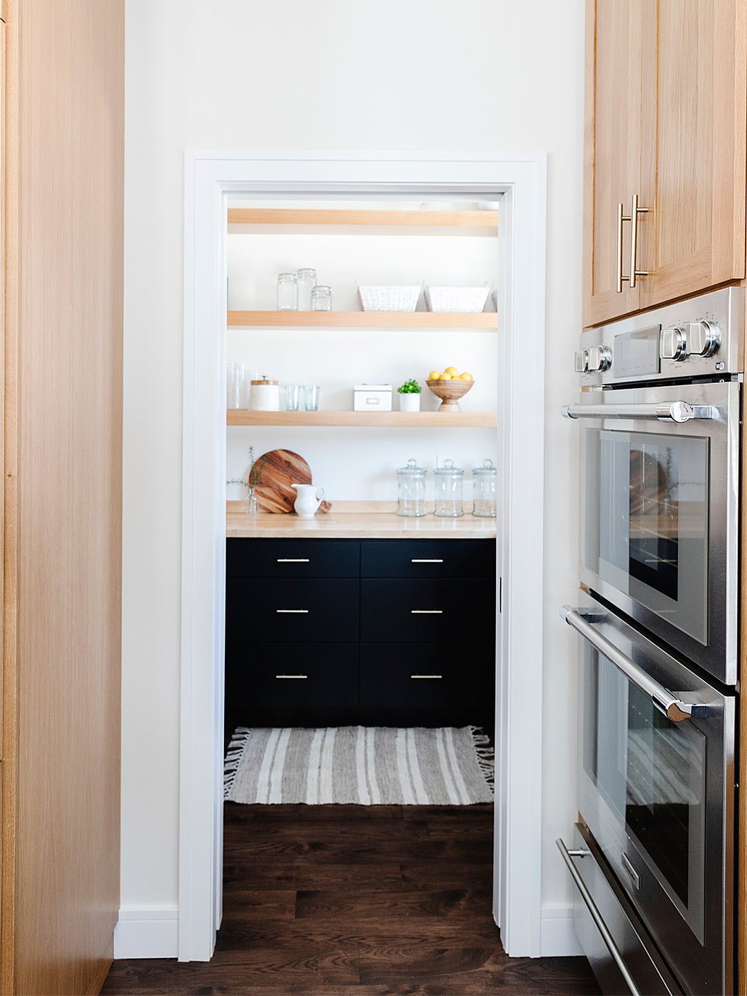 walk in pantry with floating shelves