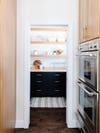 walk in pantry with floating shelves