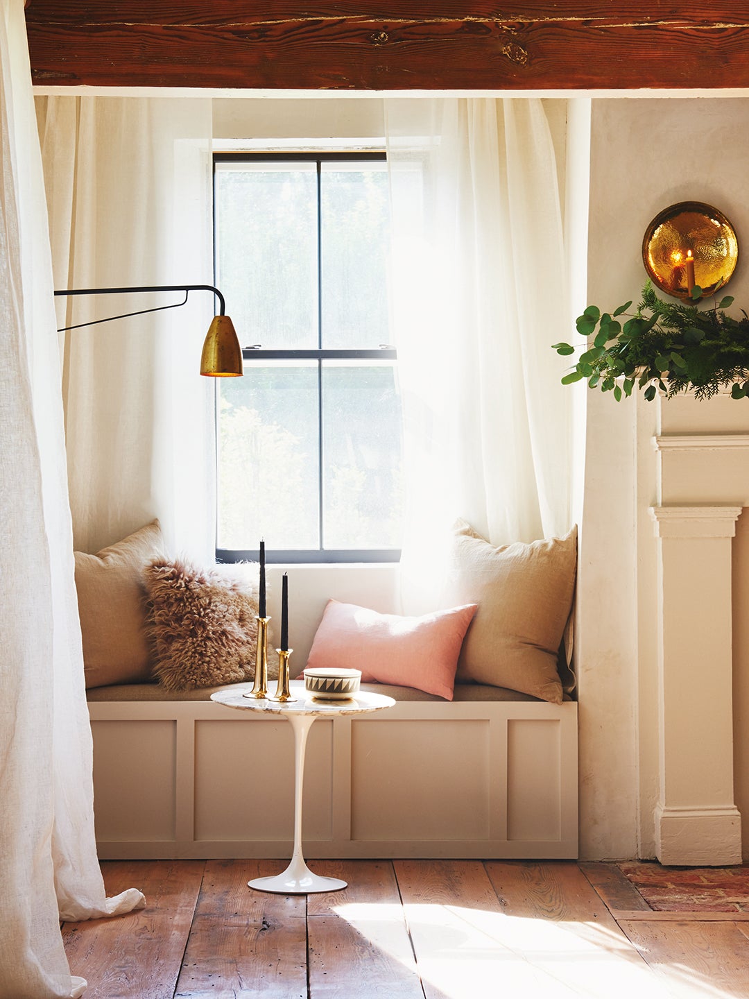 built-in window seat with pink pillows
