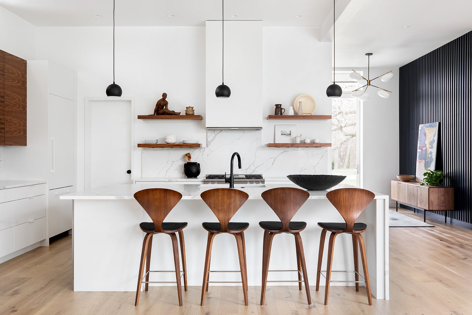 White and Marble Kitchen With Wood Cherner Stools