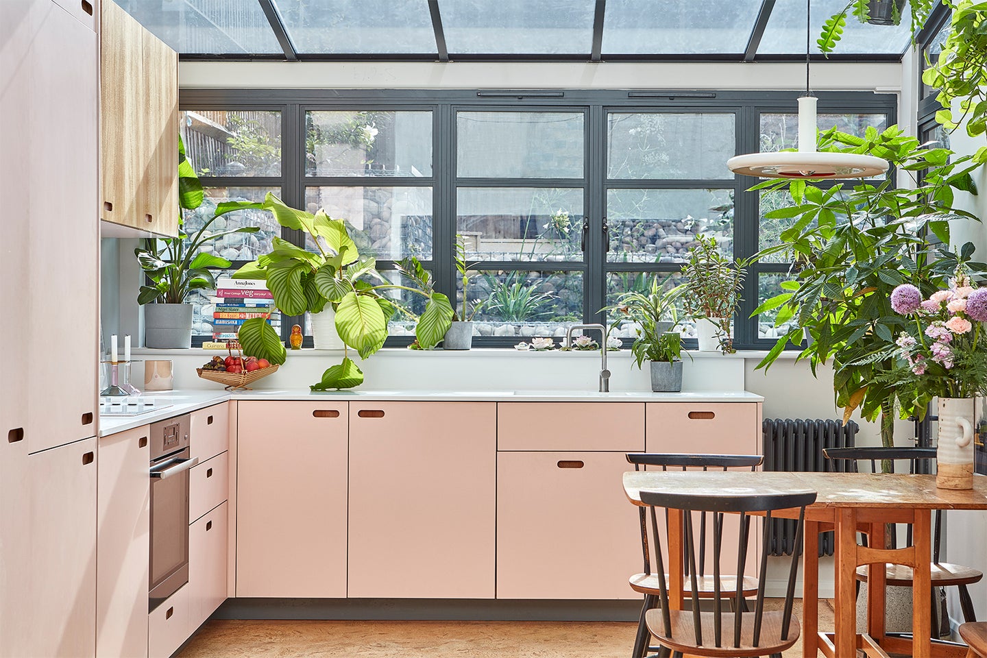pink kitchen with glass roof