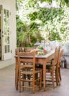 wooden table and chairs in a patio