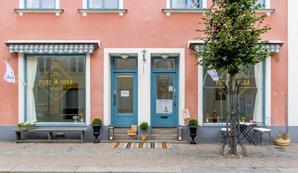 pink/terracotta facade and blue windows