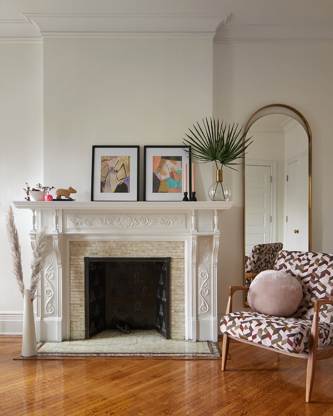 white fireplace and art