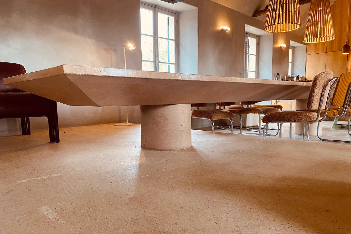 six-foot-long pink concrete dining table