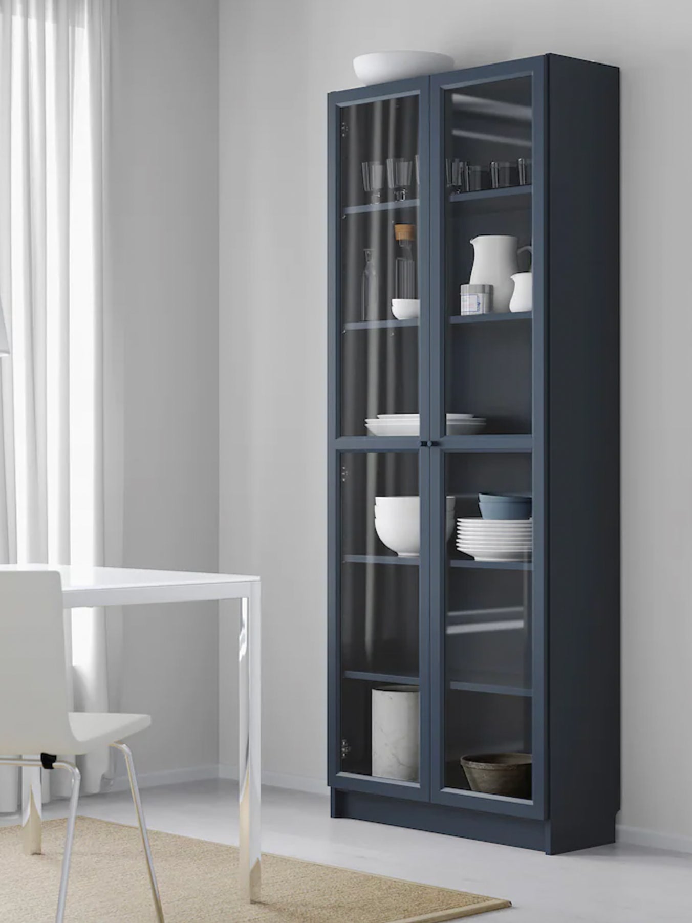 navy ikea billy bookcase with glass doors