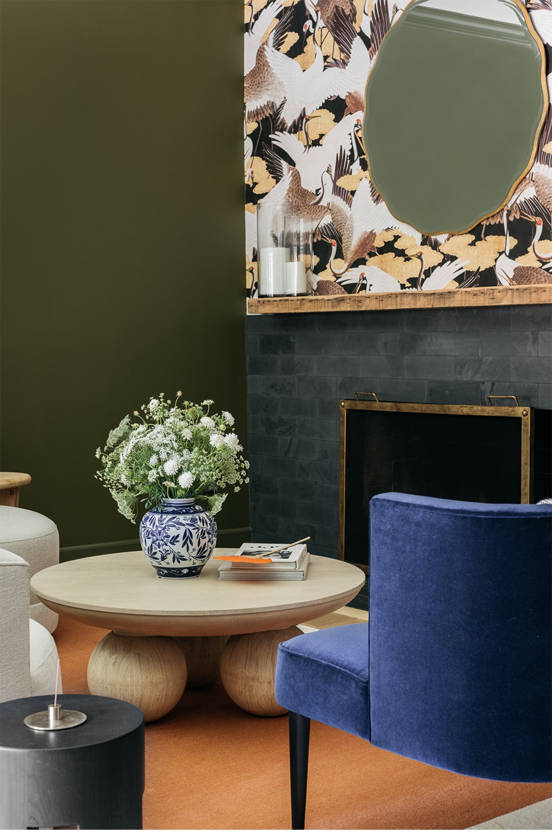 Blue Chair, Round Wood Coffee Table, Wallpaper Fireplace