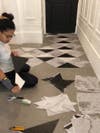 woman applying floor tiles