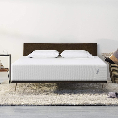 Twin Mattress on Wood Bed Frame and Shag Rug