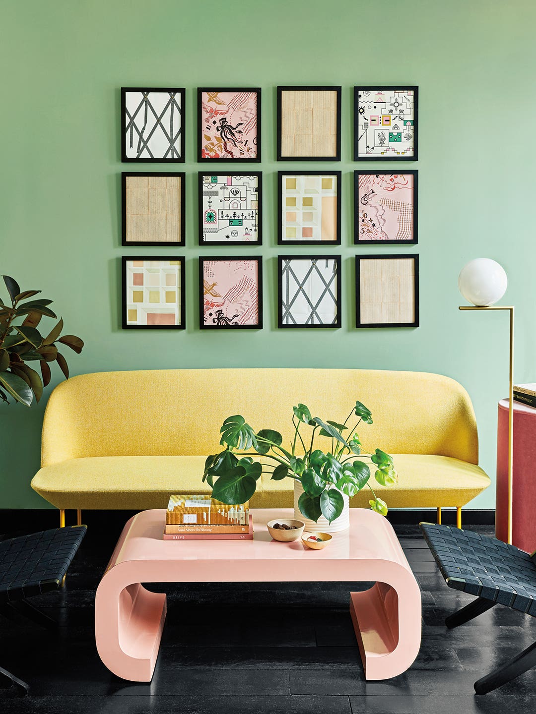 green walls, yellow sofa and pink coffee table