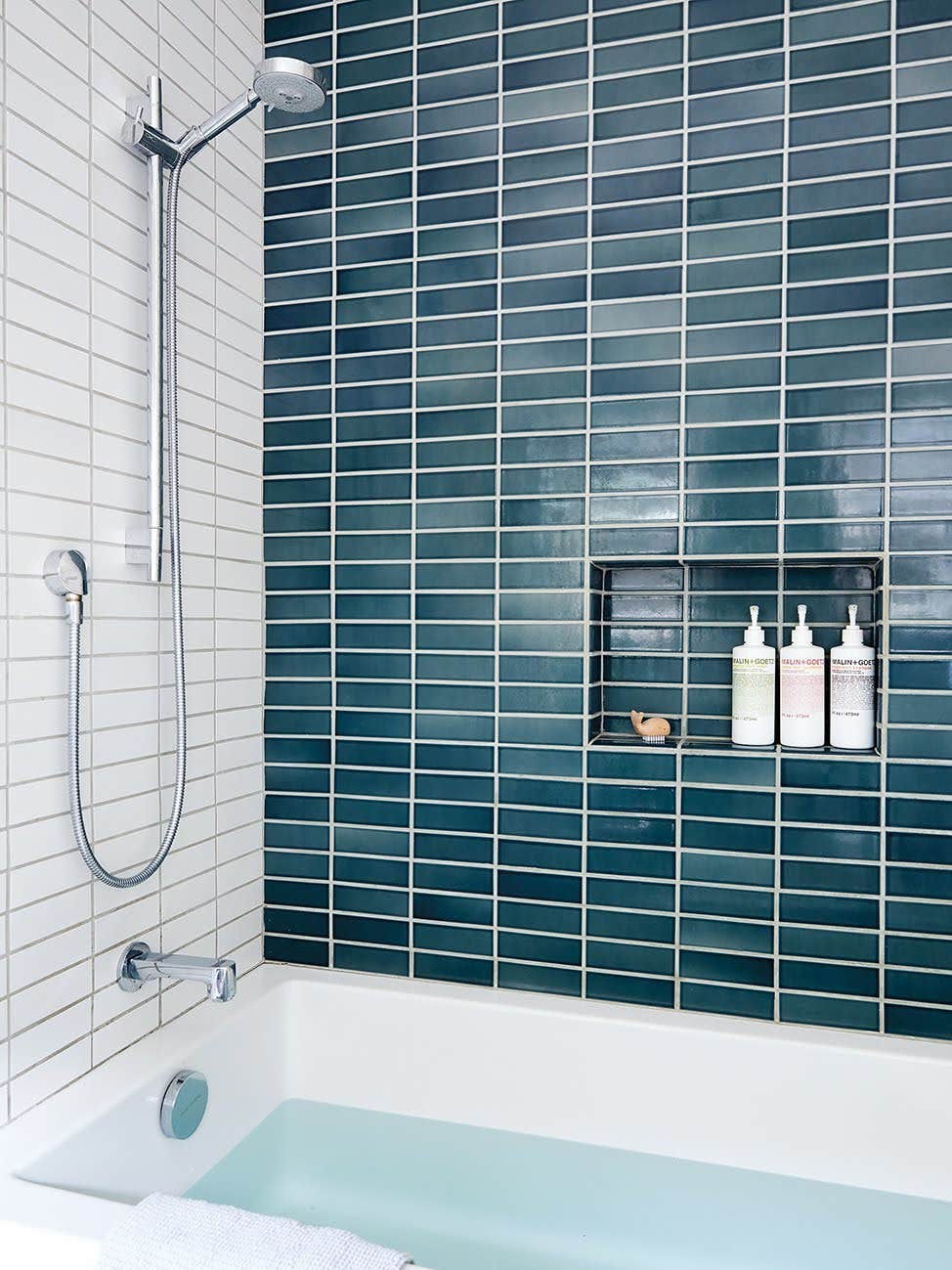 blue and white tiled shower