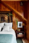 wood paneled bedroom