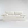 White slipcovered sofa