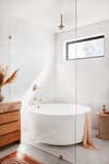 round tub in glass shower