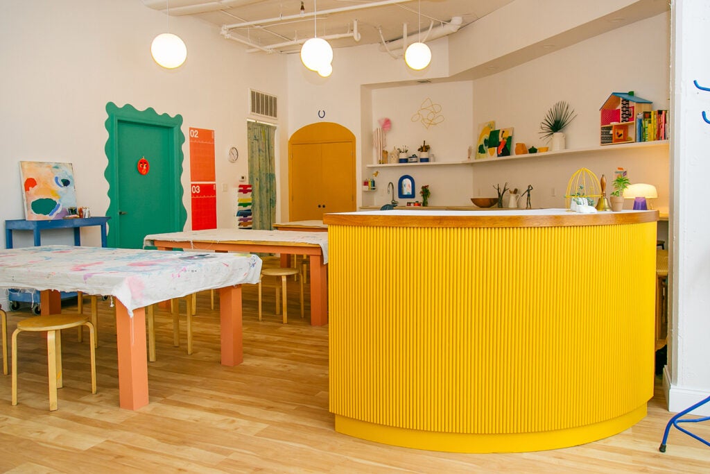 kids' playroom with wooden tables and stools