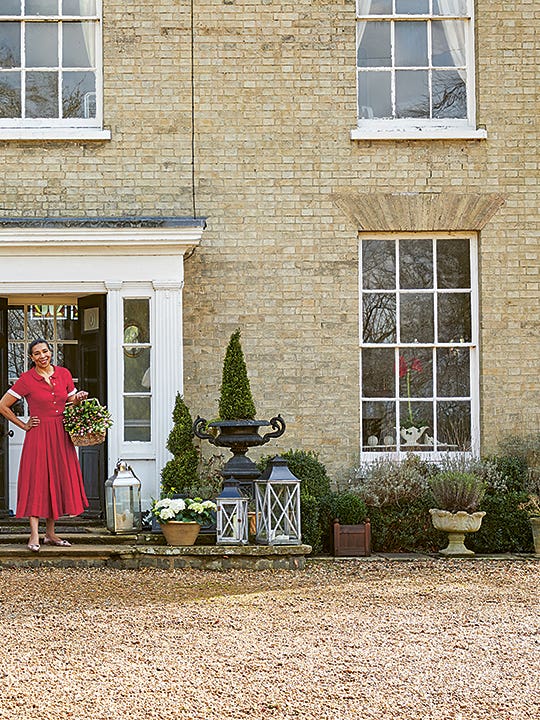 Paula Sutton in front of her home in the country