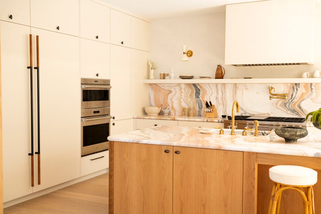 white kitchen with wood island