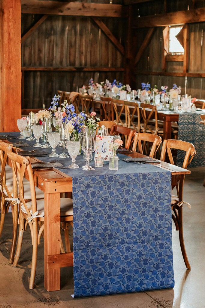 floral indigo table runner on farm table at wedding