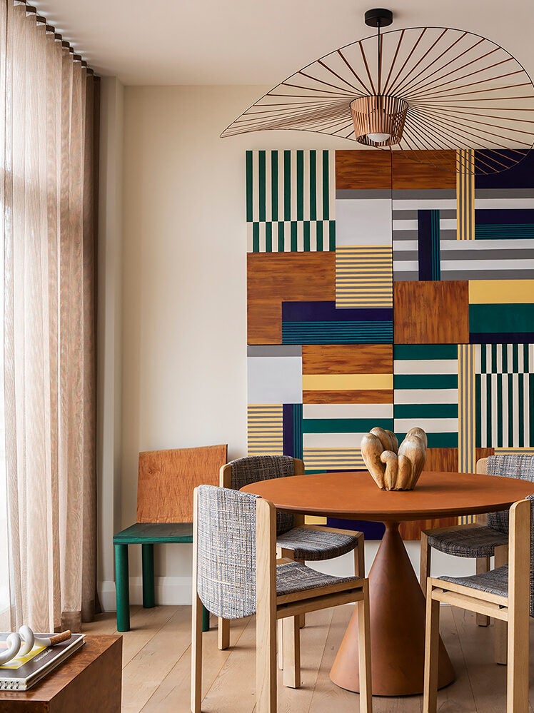 colorful dining room with graphic art on the wall