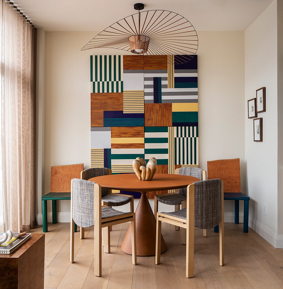colorful dining room with graphic art on the wall