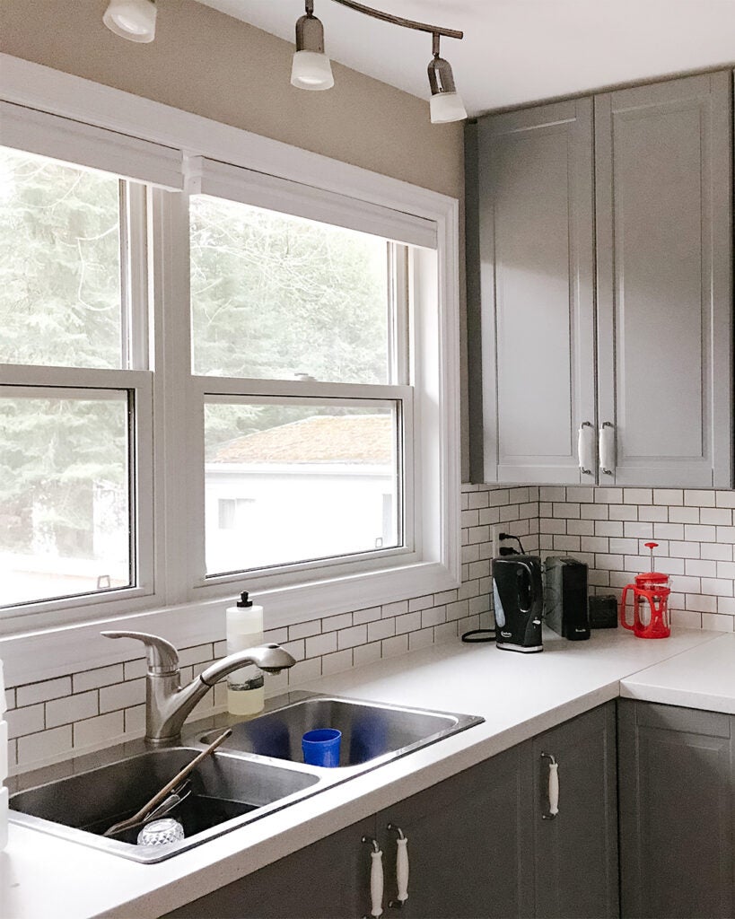 gray cabinets and white subway tile