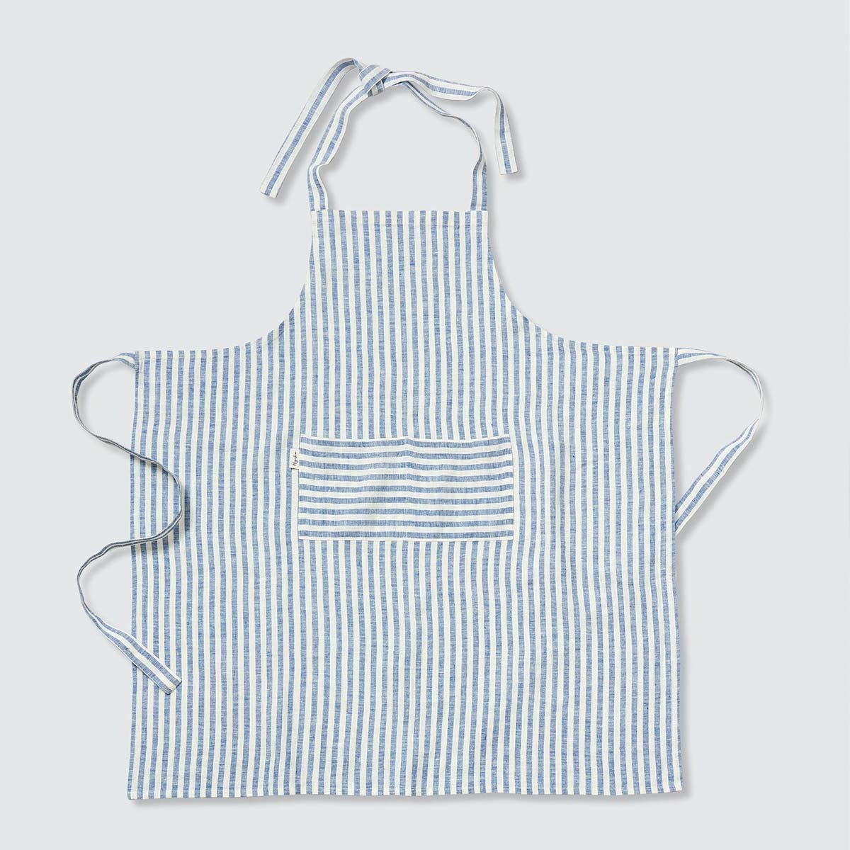 striped white and blue linen apron