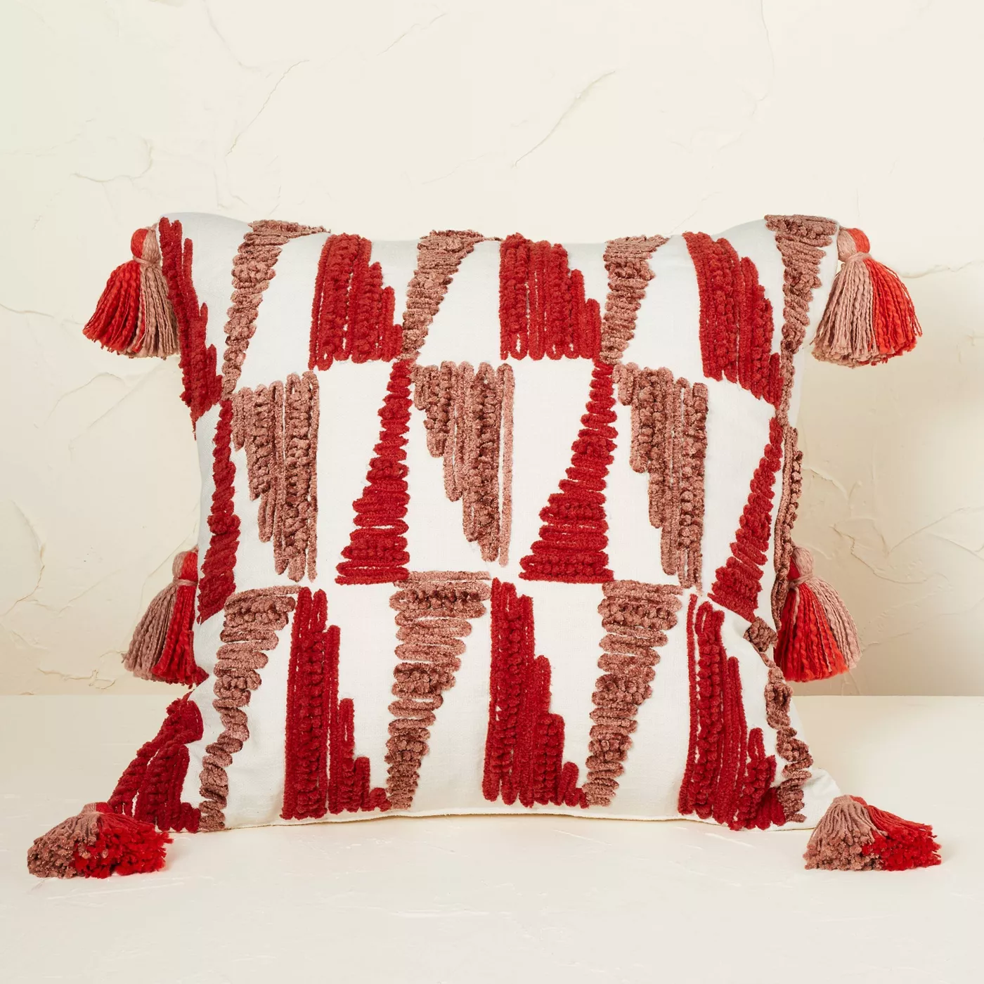 red embroidered throw pillow