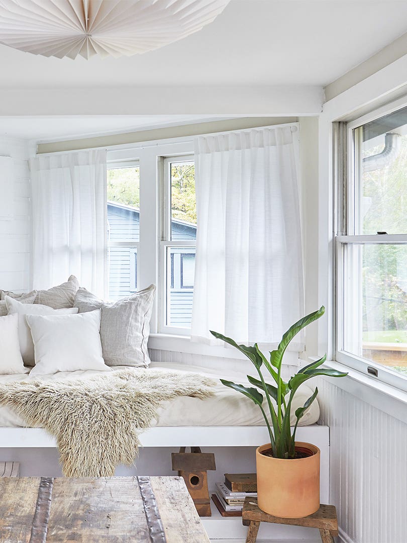 white sunroom with daybed