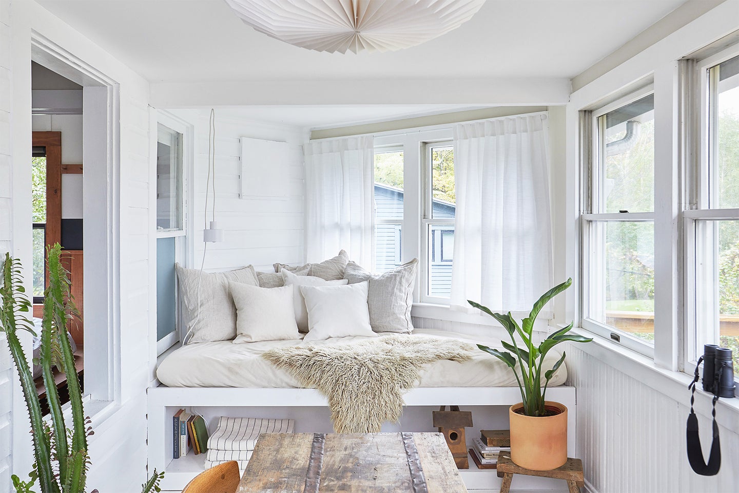 white sunroom with daybed