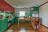 big green and red kitchen