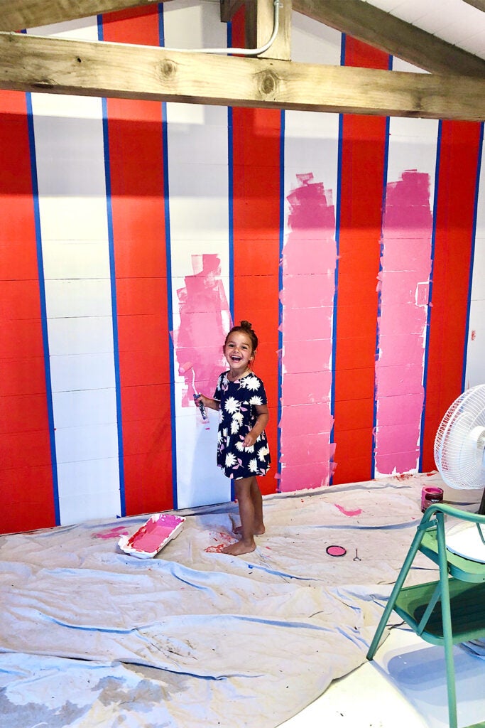girl painting walls