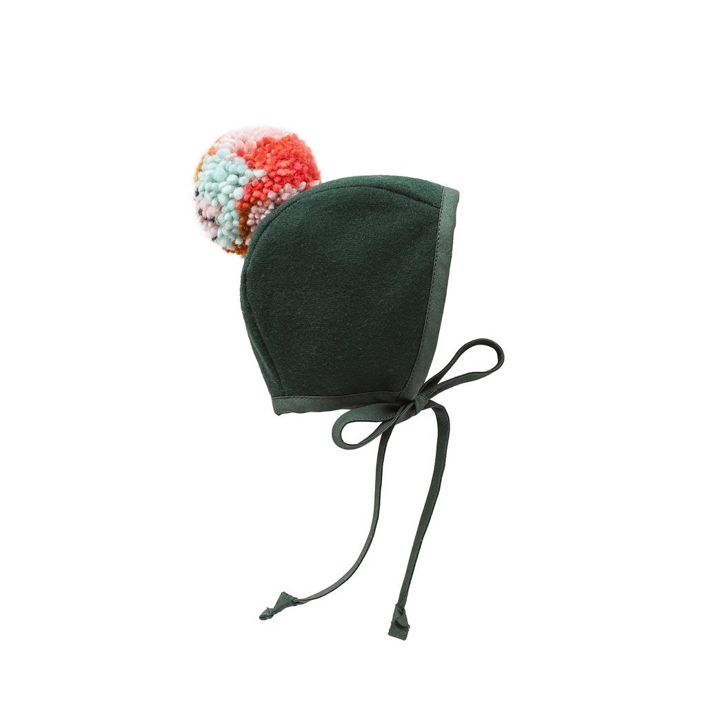 emerald bonnet with a big pom pom