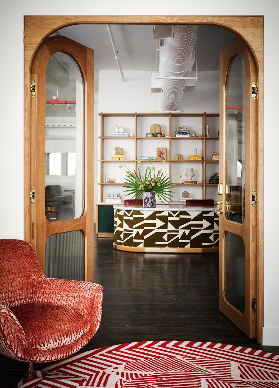 arched glass doors and red armchair