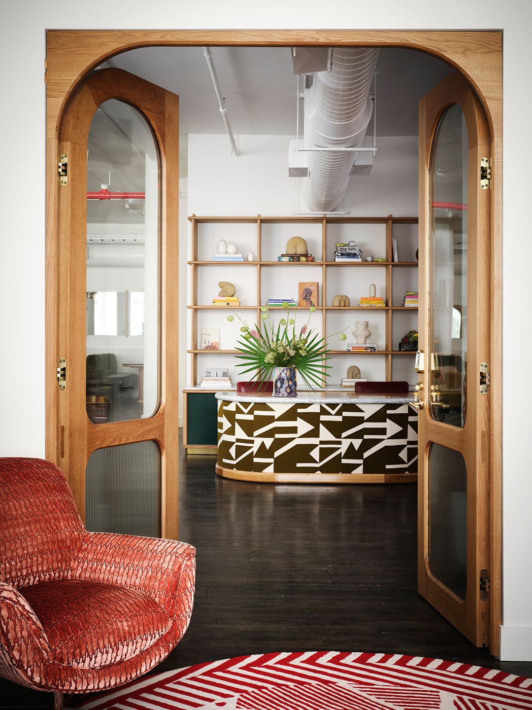 arched glass doors and red armchair