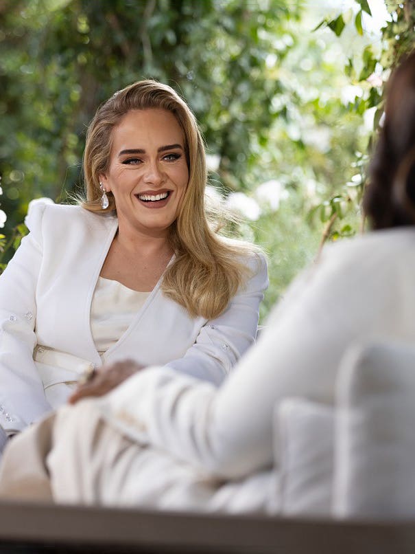 photo of adele in a white suit
