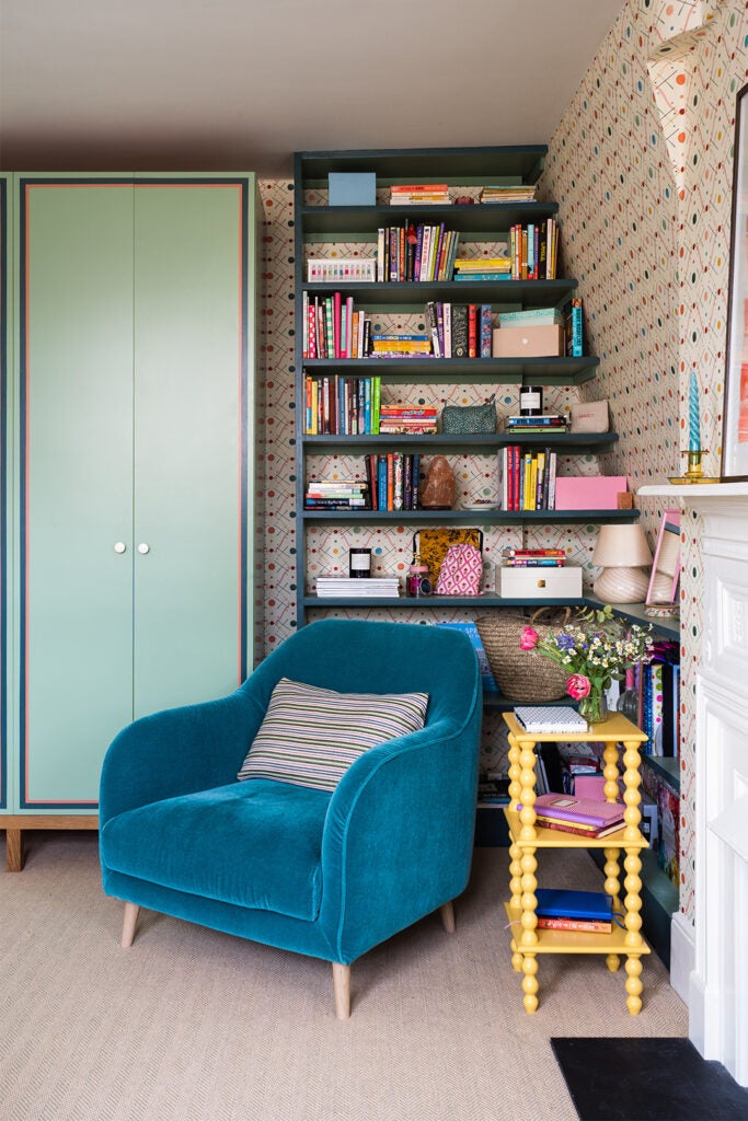 Blue Mohair Chair in front of Bespoke Shelves and Custom Wardrobe