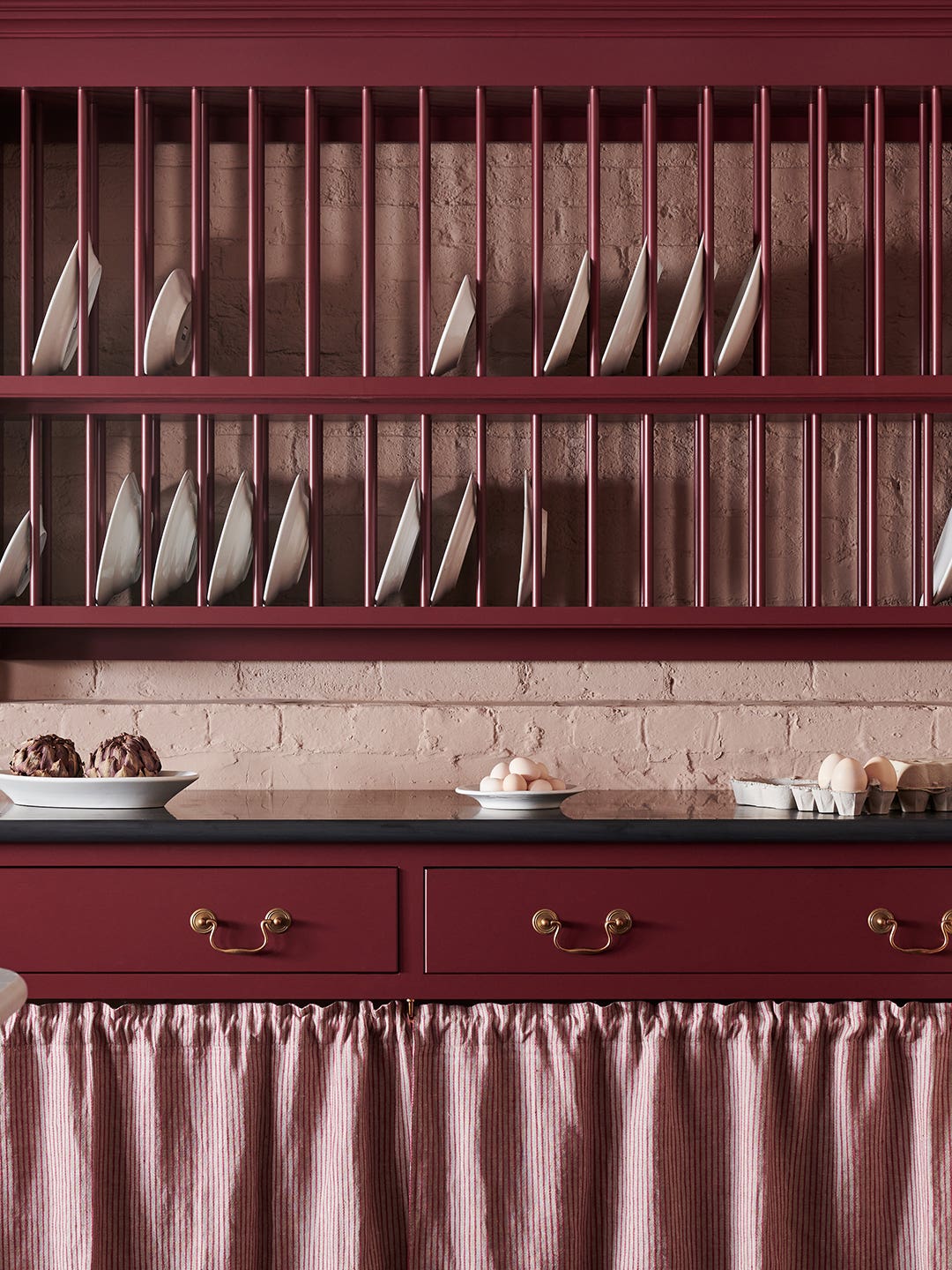 maroon plate rack and cabinets