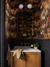 bathroom wil leafy orange and brown wallpaper