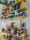 colorful vases layout on wooden shelves
