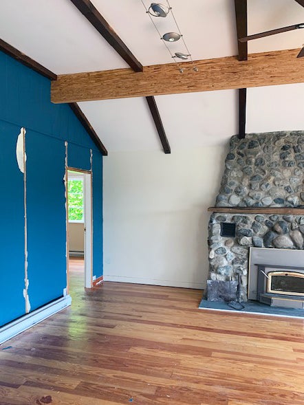 dated room with stone fireplace