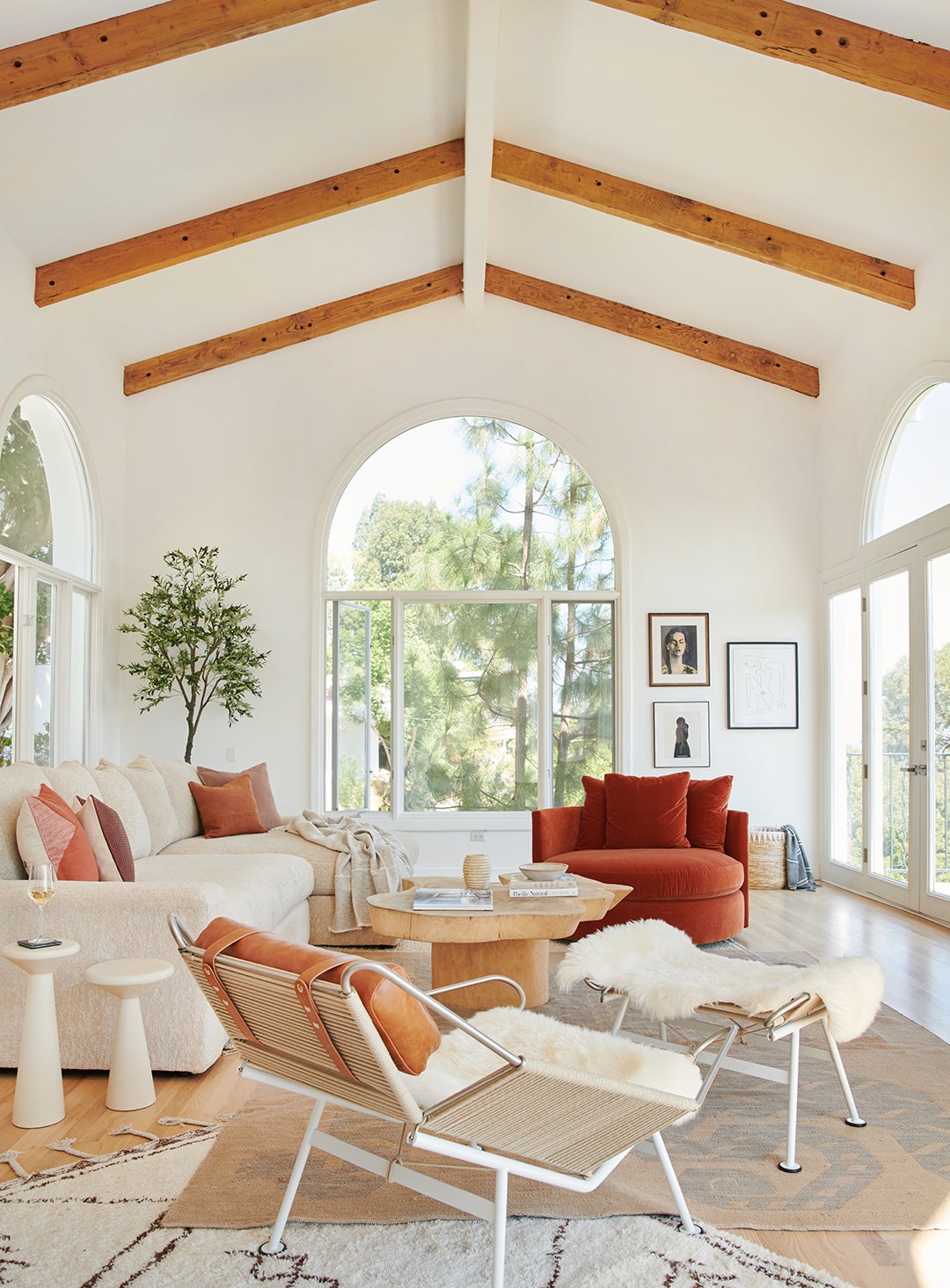 living room makeover, white walls with beige sectional sofa and terracotta armchair