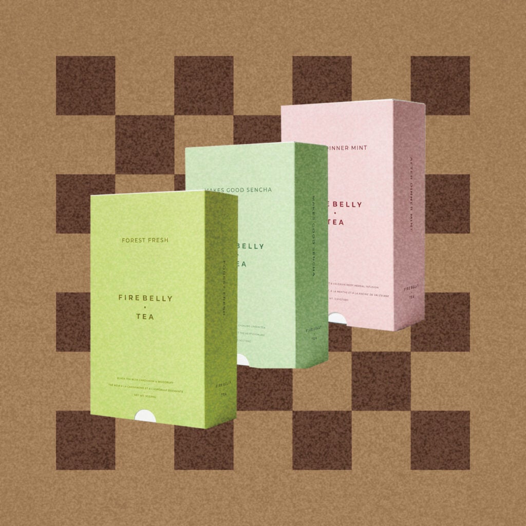 three tea boxes on a checkered brown background