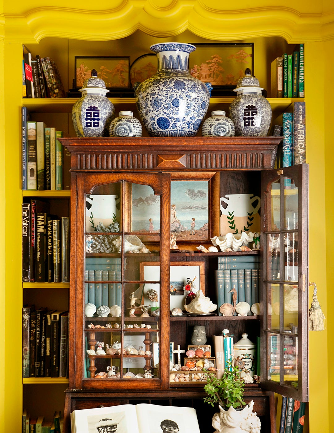 vintage wood cabinet in yellow room