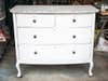 wooden dresser painted in white