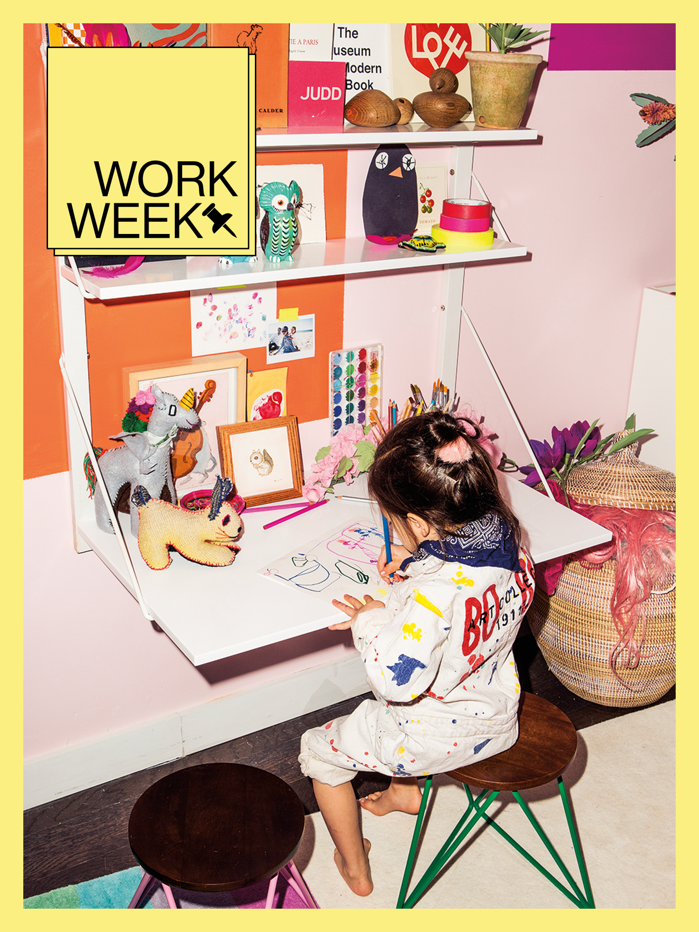Kid coloring at wall-mounted desk with yellow Work Week border and design badge.