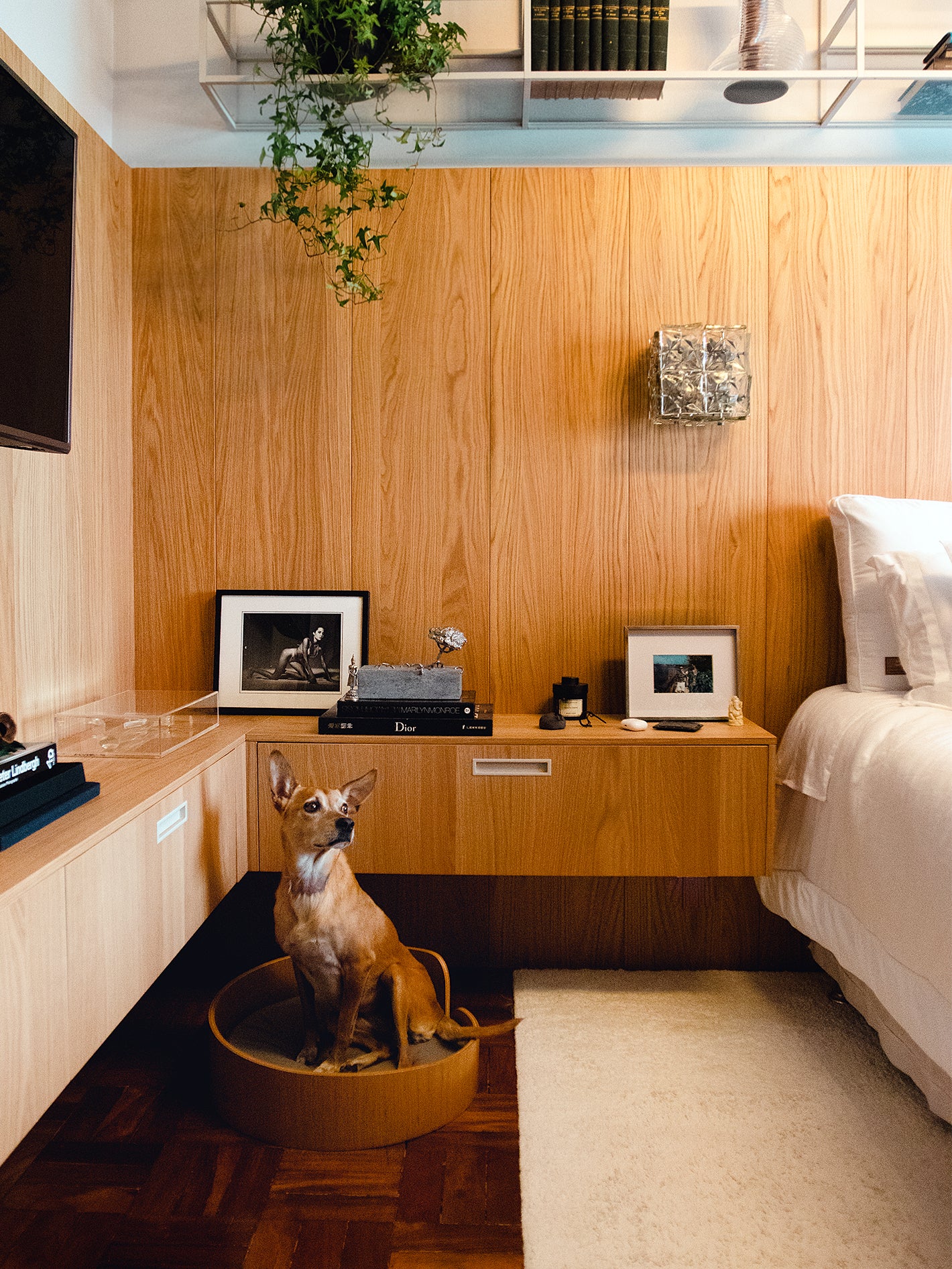 bedroom with wood paneled walls